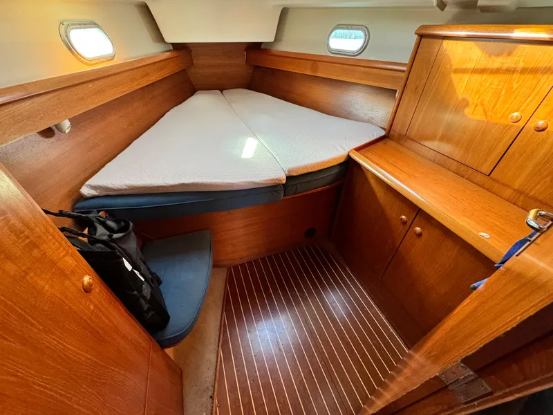 Slide: The Image of Cabin interior of 2001 Jeanneau Sun Odyssey 40 sailboat with wooden furnishings. - 41
