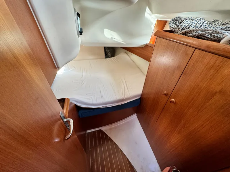 Slide: The Image of Cabin interior of 2001 Jeanneau Sun Odyssey 40 sailboat with wooden furnishings. - 44