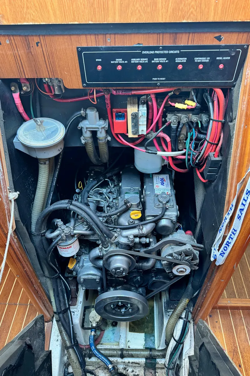 Slide: The Image of Engine compartment of a 2001 Jeanneau Sun Odyssey 40 sailboat, showing wiring and components. - 47