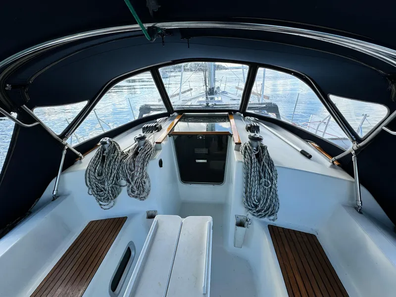 Slide: The Image of Cockpit view of 2001 Jeanneau Sun Odyssey 40 sailboat with ropes and wooden seating. - 5