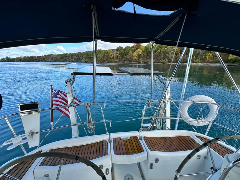 Slide: The Image of Jeanneau Sun Odyssey 40 sailboat cockpit with scenic water view, 2001 model. - 7