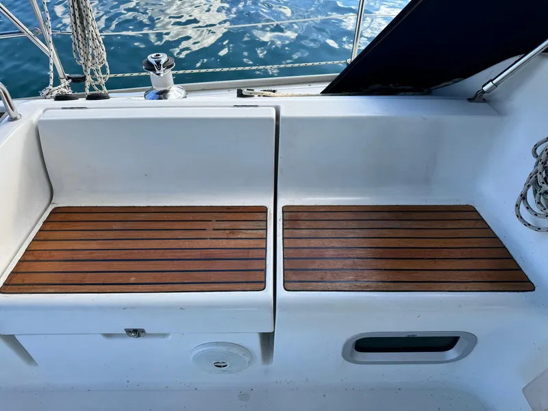 Slide: The Image of Cockpit seating area on a 2001 Jeanneau Sun Odyssey 40 sailboat with wooden slats. - 8