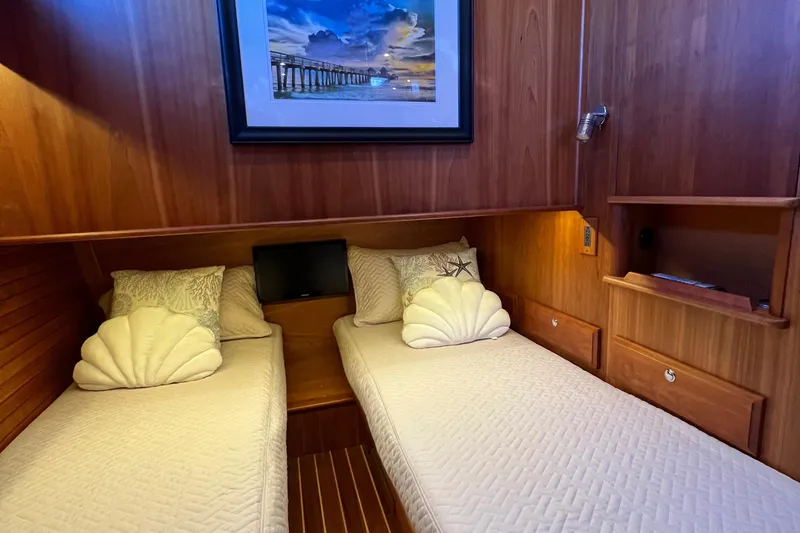 Slide: The Image of Cozy twin cabin in 2018 Sabre 45 Salon Express yacht with wooden interior. - 20
