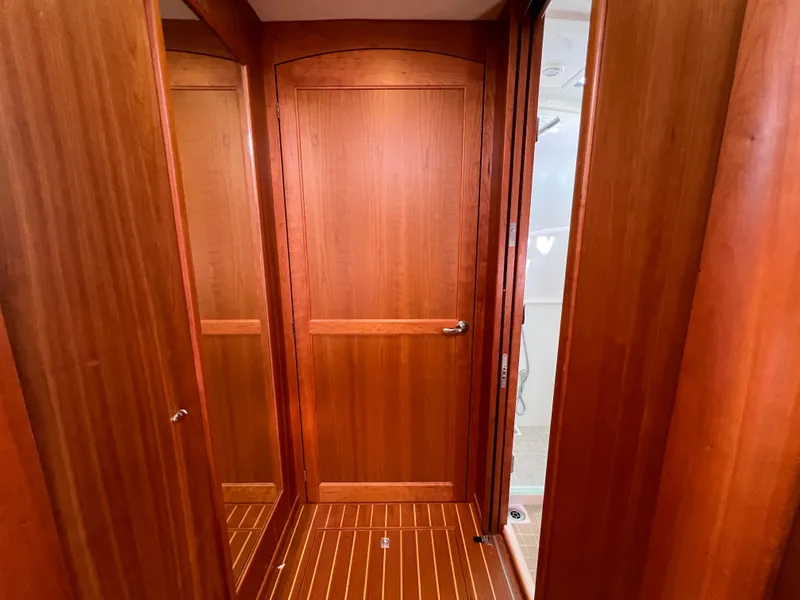 Slide: The Image of Interior of 2018 Sabre 45 Salon Express with wooden doors and flooring. - 21