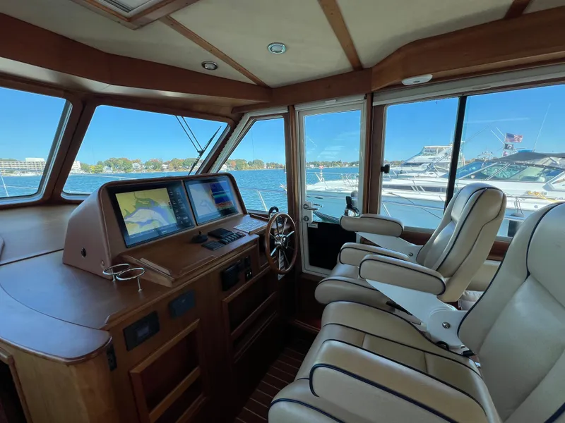 Slide: The Image of Interior of 2018 Sabre 45 Salon Express yacht with navigation system and leather seats. - 29