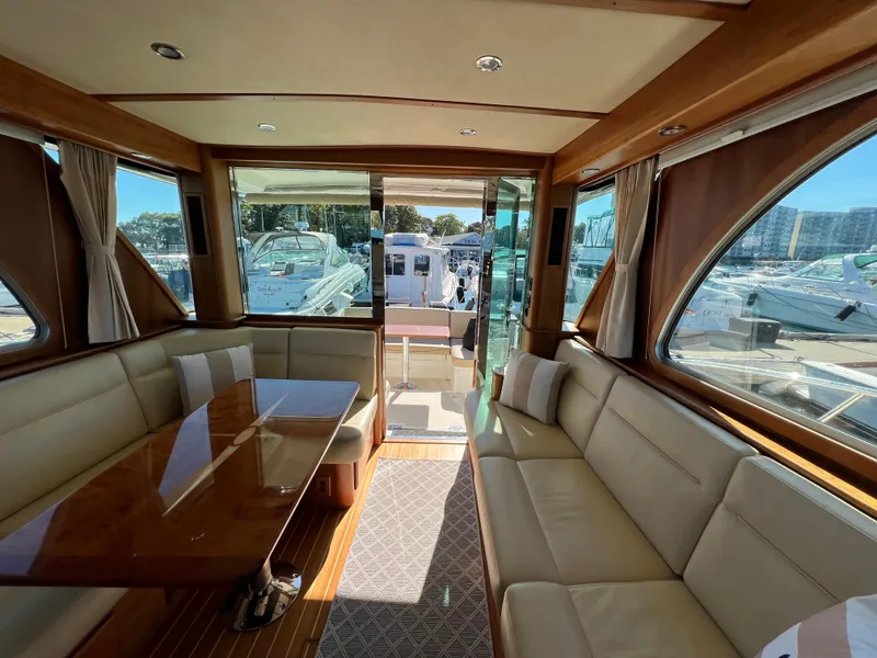 Slide: The Image of Interior of 2018 Sabre 45 Salon Express yacht with elegant seating and wooden table. - 32