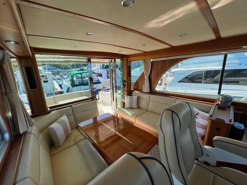 Slide: The Image of Luxurious interior of 2018 Sabre 45 Salon Express yacht with elegant seating and large windows. - 33