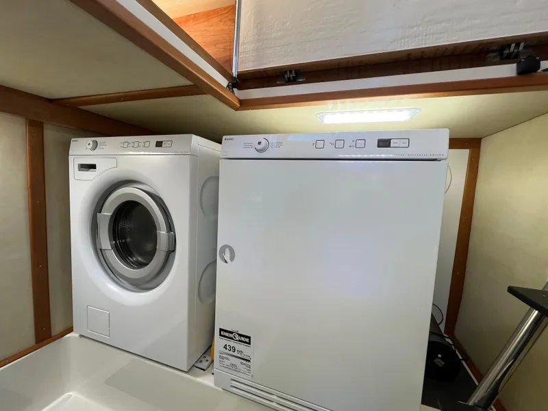 Slide: The Image of Laundry appliances inside 2018 Sabre 45 Salon Express yacht. - 35