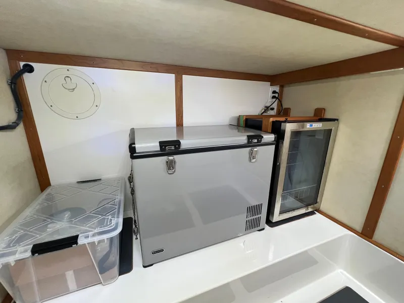 Slide: The Image of 2018 Sabre 45 Salon Express interior with fridge and storage. - 36