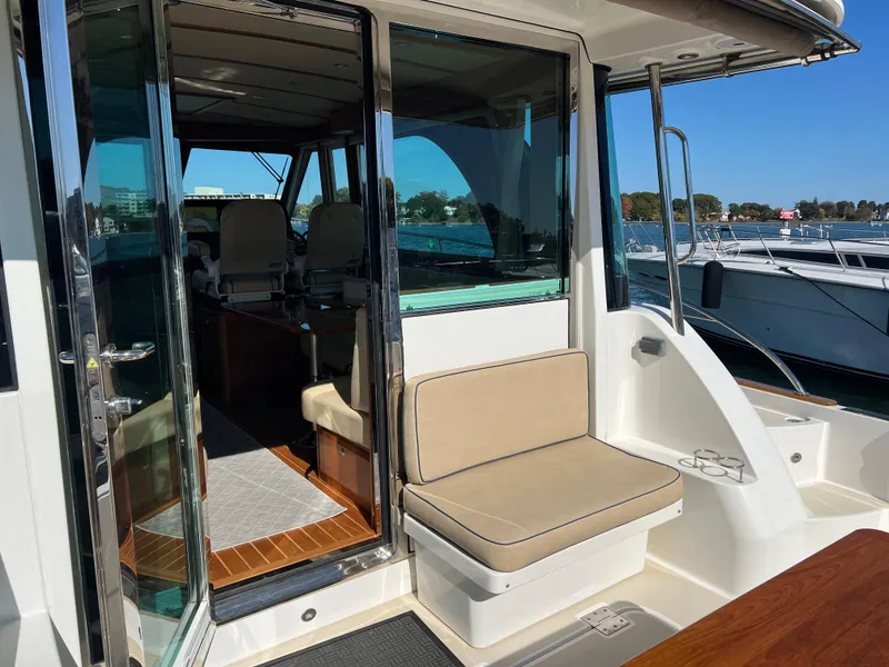 Slide: The Image of 2018 Sabre 45 Salon Express yacht with open cabin and seating area. - 37