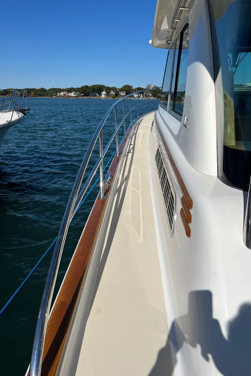 Slide: The Image of 2018 Sabre 45 Salon Express yacht on calm water, side view. - 41