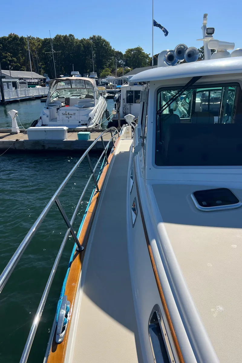 Slide: The Image of 2018 Sabre 45 Salon Express yacht docked at marina, sunny day. - 42