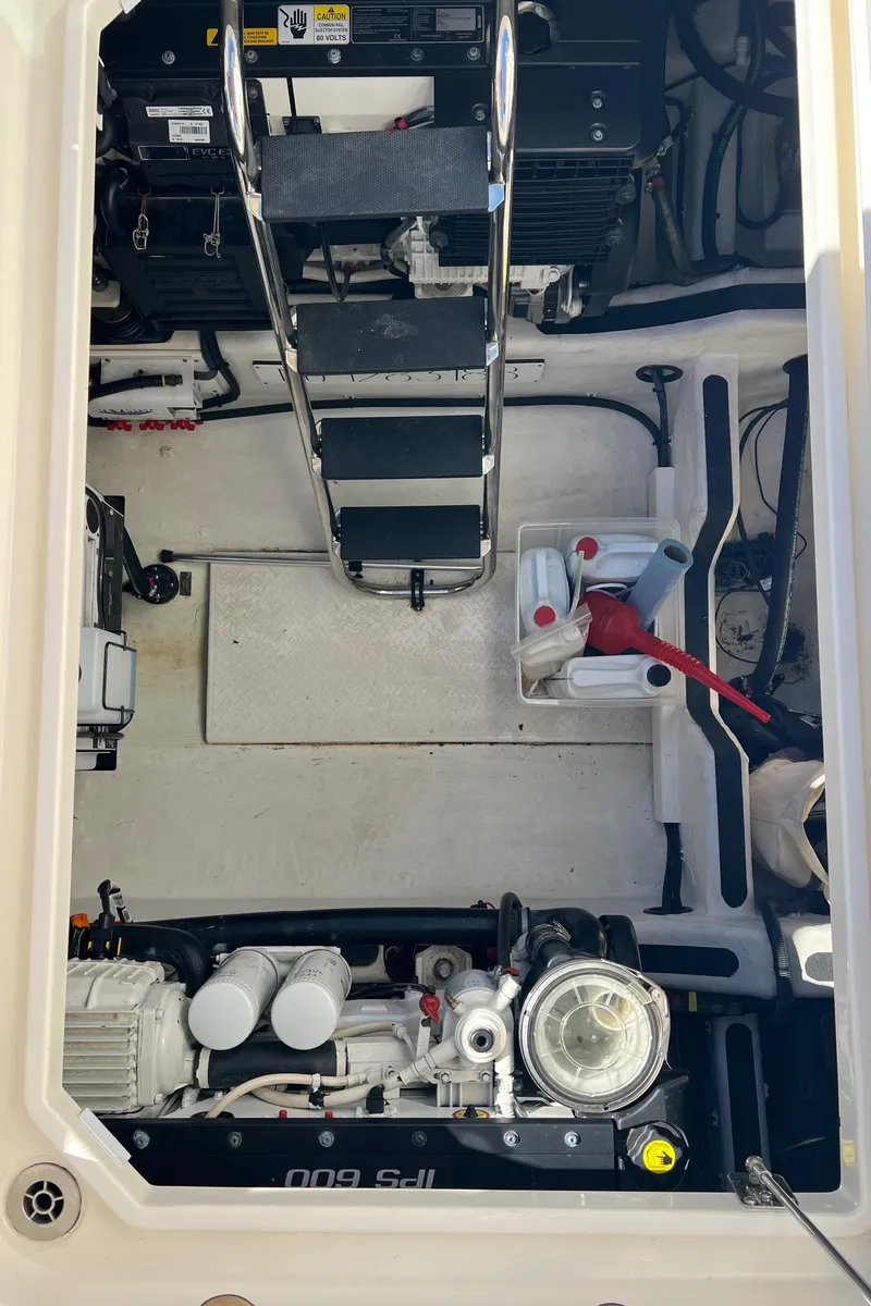 Slide: The Image of Engine room of 2018 Sabre 45 Salon Express yacht, showcasing mechanical components and equipment. - 47