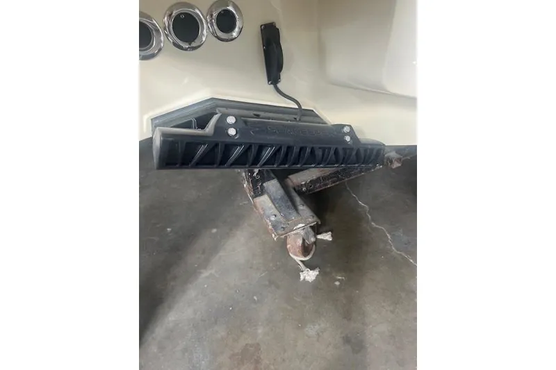 Slide: The Image of 2024 Chris-Craft Catalina 28 boat detail showing hull and trailer connection. - 10