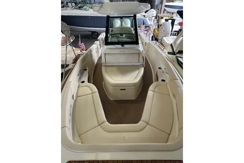 Slide: The Image of 2024 Chris-Craft Catalina 28 boat interior with luxurious seating and elegant design. - 7