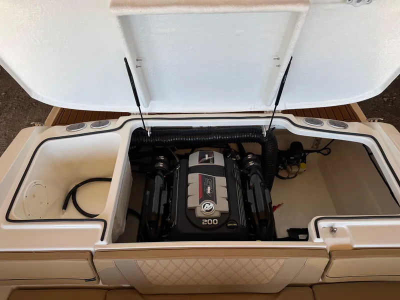 Slide: The Image of 2025 Bayliner VR4 Bowrider I/O engine compartment with open hatch. - 14