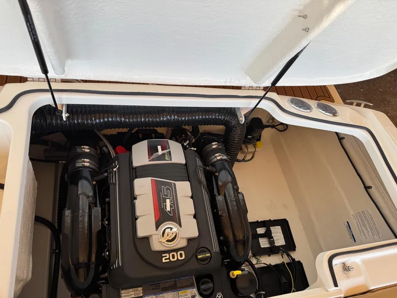 Slide: The Image of 2025 Bayliner VR4 Bowrider I/O engine compartment with 200 HP motor. - 16