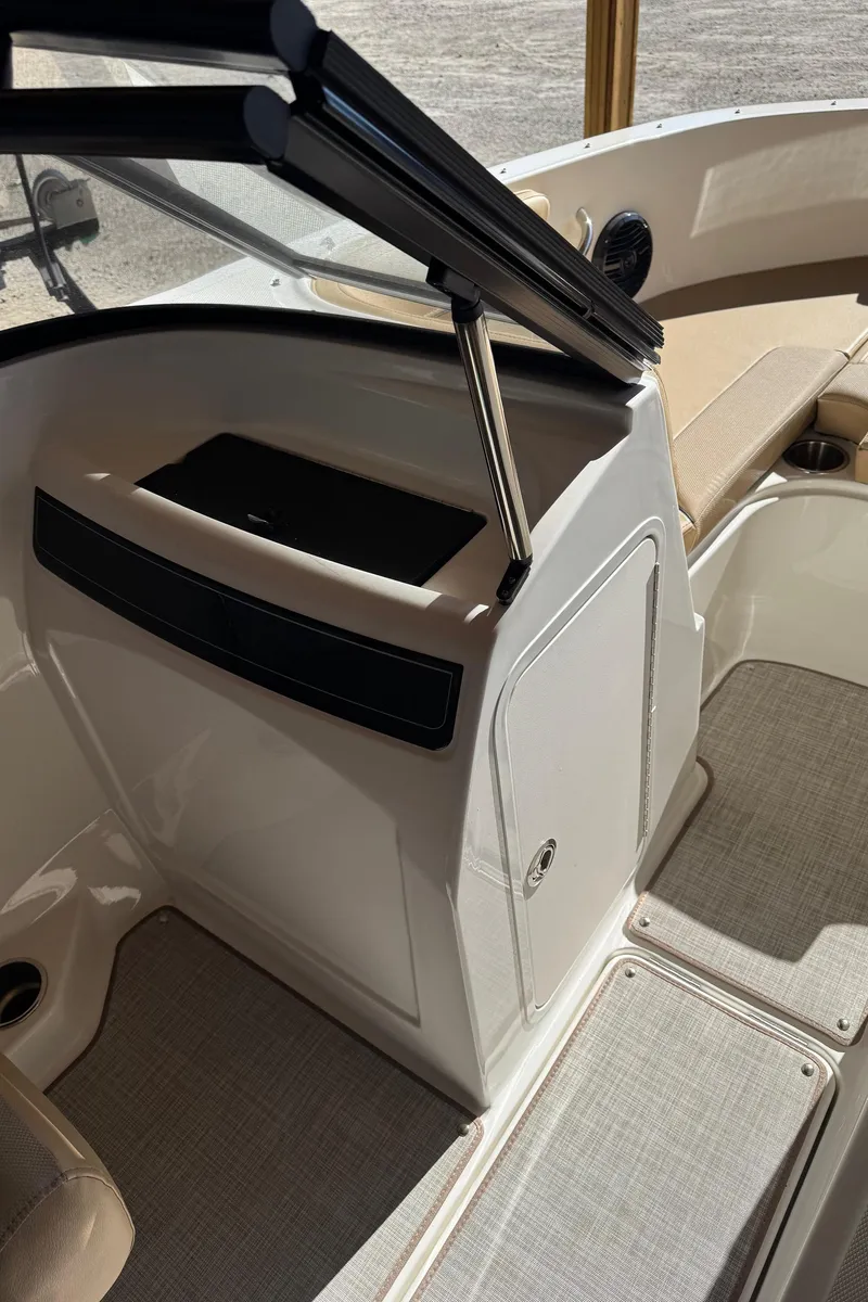 Slide: The Image of 2025 Bayliner VR4 Bowrider I/O interior with seating and storage. - 17