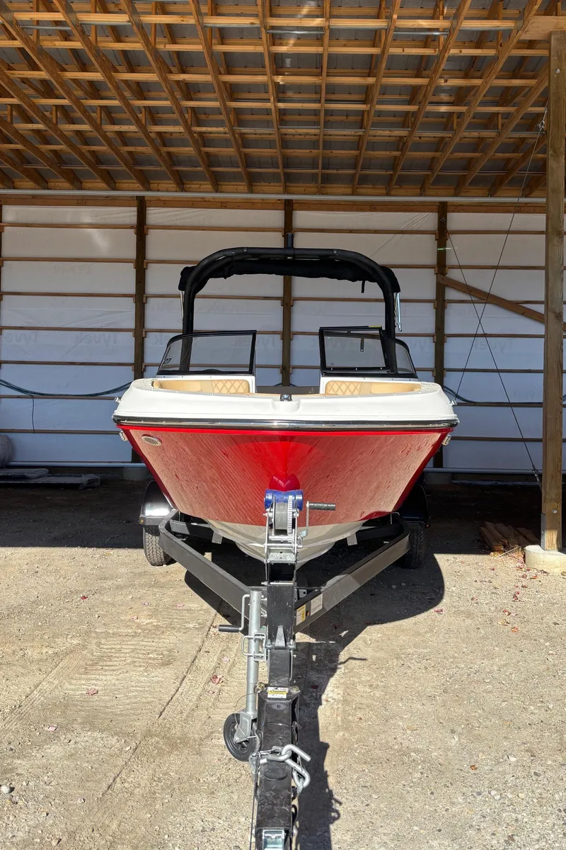 Slide: The Image of 2025 Bayliner VR4 Bowrider I/O in storage, front view. - 2