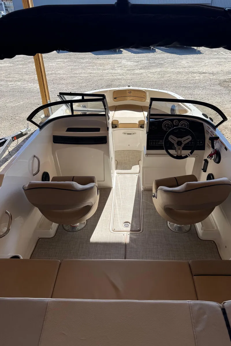 Slide: The Image of 2025 Bayliner VR4 Bowrider I/O interior with dual seats and steering console. - 20