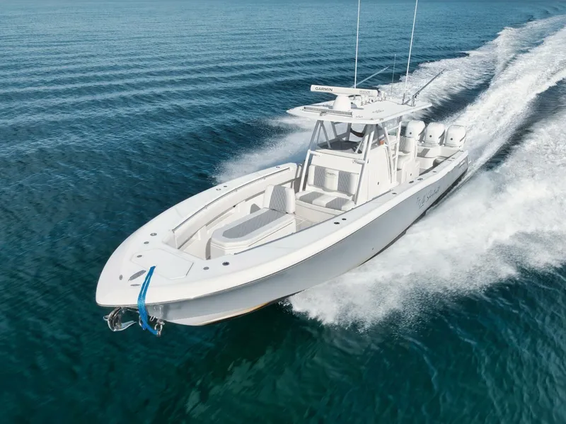 Slide: The Image of 2020 Invincible Open Fisherman boat cruising on clear blue water. - 10