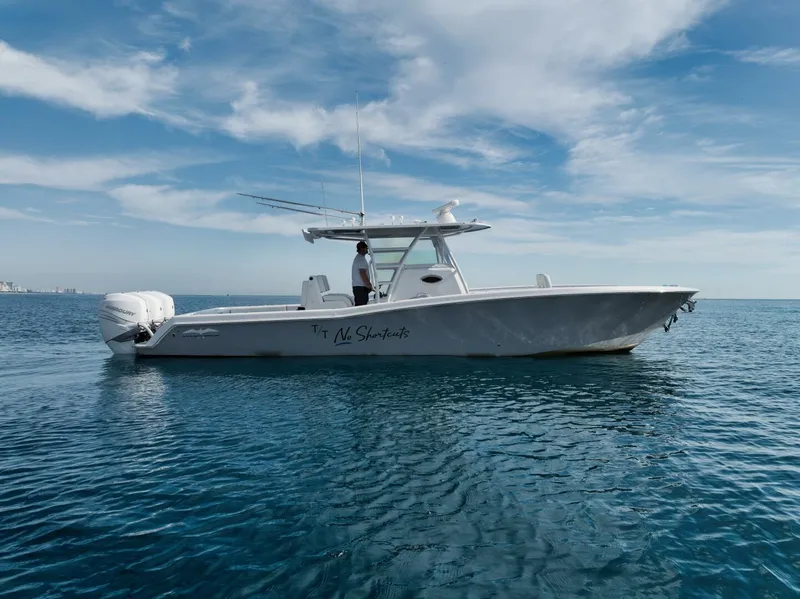Slide: The Image of 2020 Invincible Open Fisherman boat on calm ocean waters under a blue sky. - 13