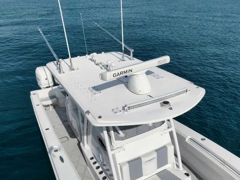 Slide: The Image of 2020 Invincible Open Fisherman boat with Garmin equipment on blue ocean water. - 18