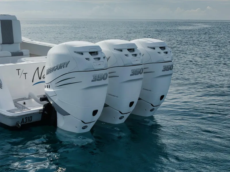 Slide: The Image of 2020 Invincible Open Fisherman boat with triple Mercury 350 outboard engines on the ocean. - 20