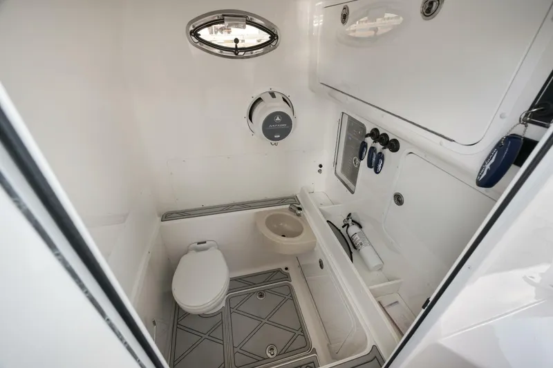 Slide: The Image of 2020 Invincible Open Fisherman boat interior with toilet and sink. - 21