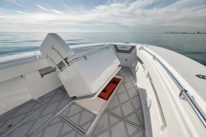 Slide: The Image of 2020 Invincible Open Fisherman boat interior with storage compartment, on calm ocean waters. - 24