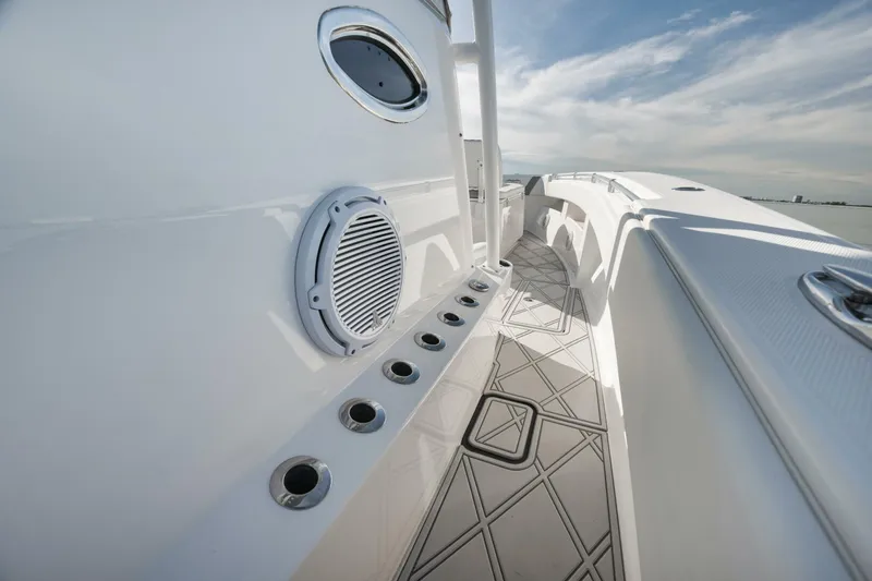 Slide: The Image of 2020 Invincible Open Fisherman boat deck with rod holders and speaker. - 26