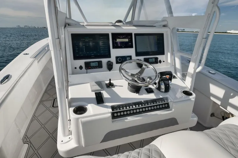 Slide: The Image of 2020 Invincible Open Fisherman boat console with advanced navigation and control systems. - 33