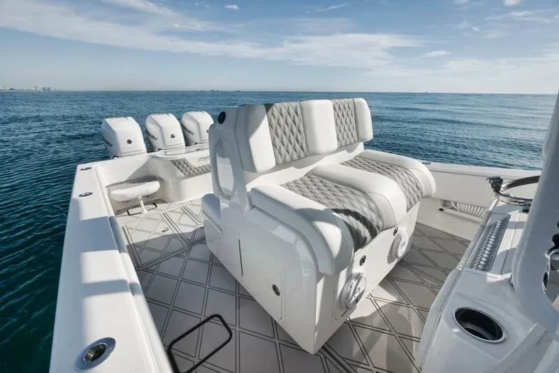 Slide: The Image of 2020 Invincible Open Fisherman boat interior with cushioned seating and ocean view. - 34