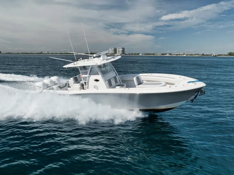 Slide: The Image of 2020 Invincible Open Fisherman boat cruising on clear blue ocean waters. - 5