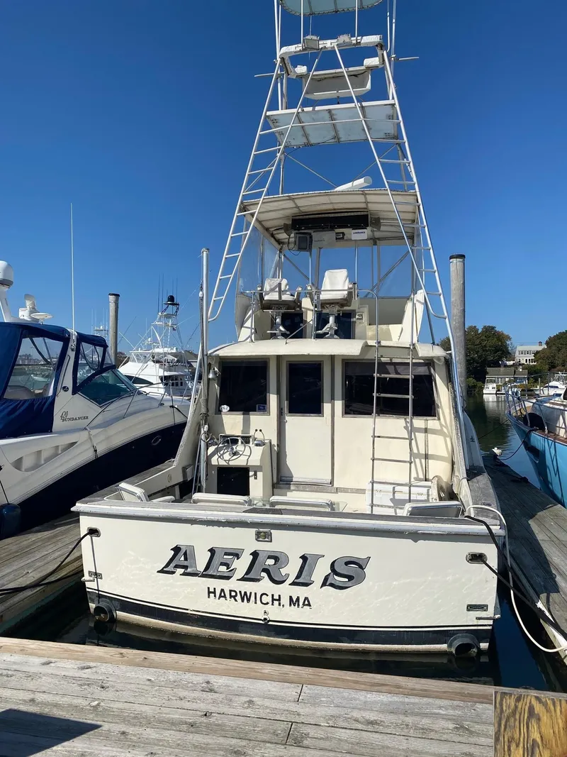 Slide: The Image of 1968 Hatteras 45 Convertible boat named "Aeris" docked in Harwich, MA. - 2