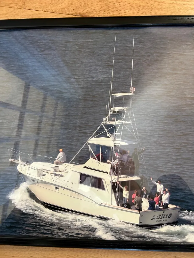 Slide: The Image of 1968 Hatteras 45 Convertible yacht cruising with passengers on board. - 4