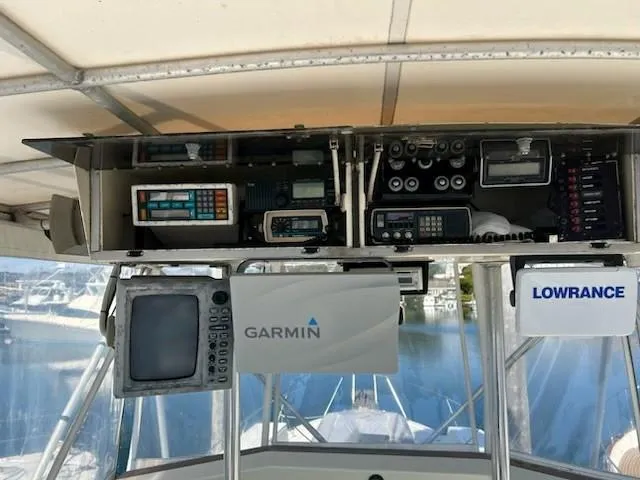 Slide: The Image of Control panel of a 1968 Hatteras 45 Convertible with Garmin and Lowrance navigation systems. - 7