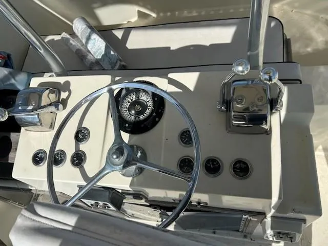 Slide: The Image of 1968 Hatteras 45 Convertible helm with steering wheel, gauges, and controls. - 8