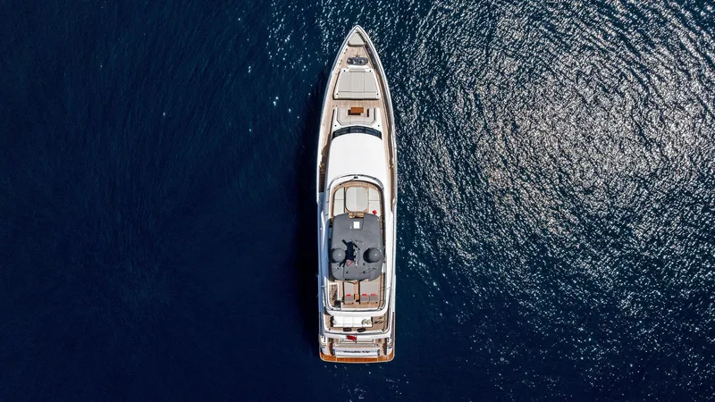 Slide: The Image of Aerial view of 2024 Custom Line Navetta 33 yacht on open water. - 14
