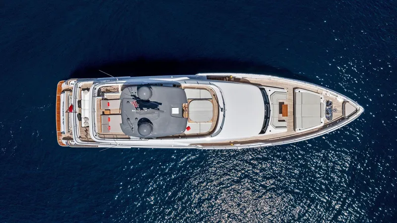 Slide: The Image of Aerial view of 2024 Custom Line Navetta 33 yacht on deep blue water. - 15