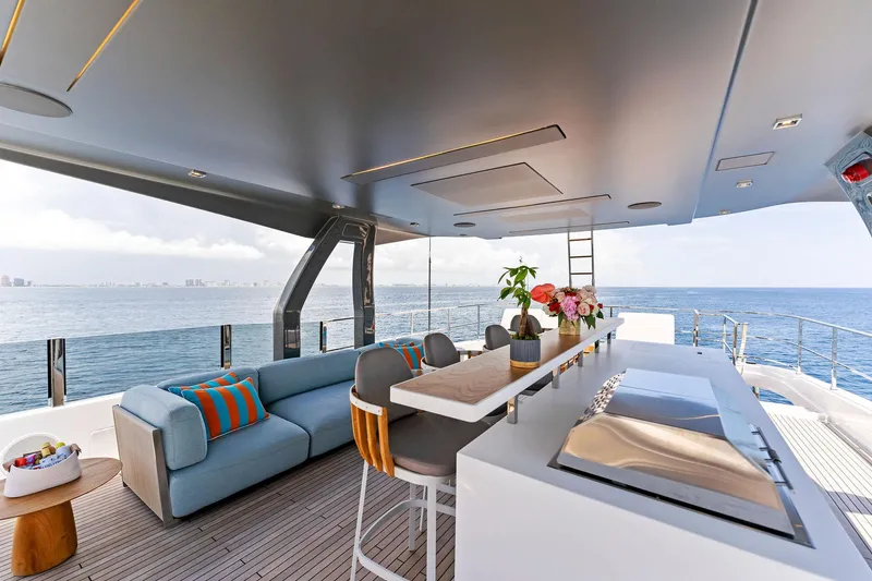 Slide: The Image of Luxurious 2024 Custom Line Navetta 33 yacht interior with modern seating and ocean view. - 21