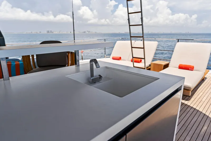 Slide: The Image of Luxury yacht deck with sink, sun loungers, and ocean view, Custom Line Navetta 33, 2024. - 22