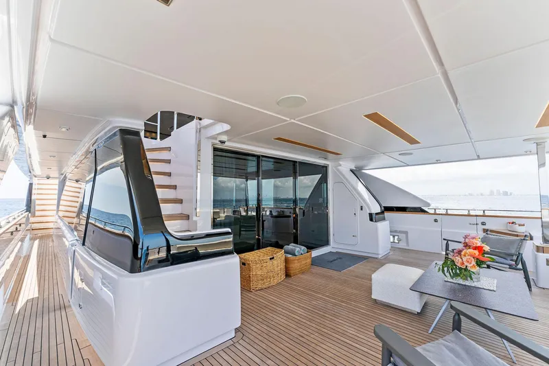 Slide: The Image of Luxurious 2024 Custom Line Navetta 33 yacht deck with modern seating and ocean view. - 33