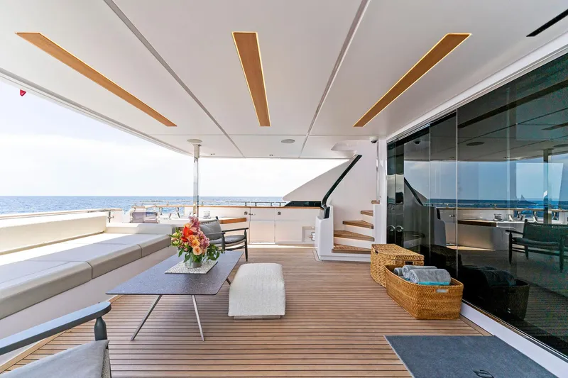 Slide: The Image of Luxurious 2024 Custom Line Navetta 33 yacht deck with elegant seating and ocean view. - 35