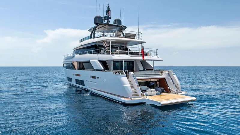 Slide: The Image of Luxurious 2024 Custom Line Navetta 33 yacht on open sea, rear view. - 4