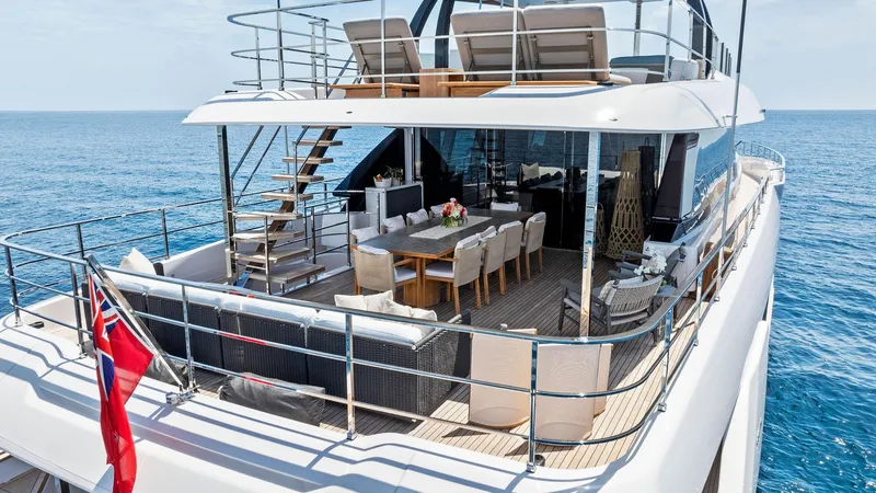 Slide: The Image of Luxurious 2024 Custom Line Navetta 33 yacht with spacious deck and elegant outdoor seating. - 5