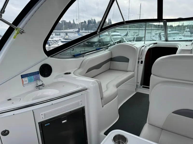 Slide: The Image of Interior of 2005 Chaparral Signature 310 boat with seating and kitchenette. - 11