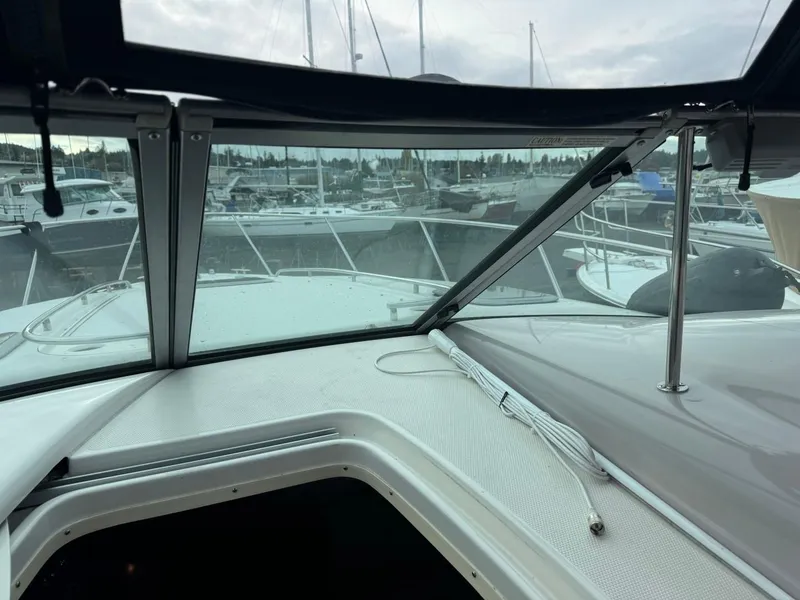 Slide: The Image of 2005 Chaparral Signature 310 boat interior view with marina background. - 22