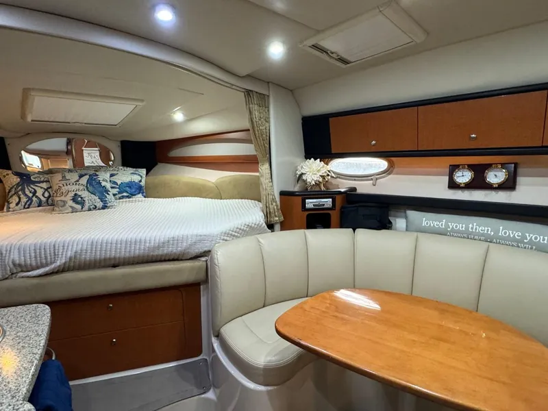 Slide: The Image of Interior of 2005 Chaparral Signature 310 boat with cozy seating and bed area. - 32