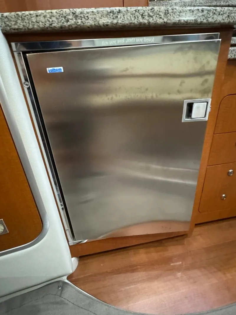 Slide: The Image of Stainless steel refrigerator in 2005 Chaparral Signature 310 boat interior. - 36
